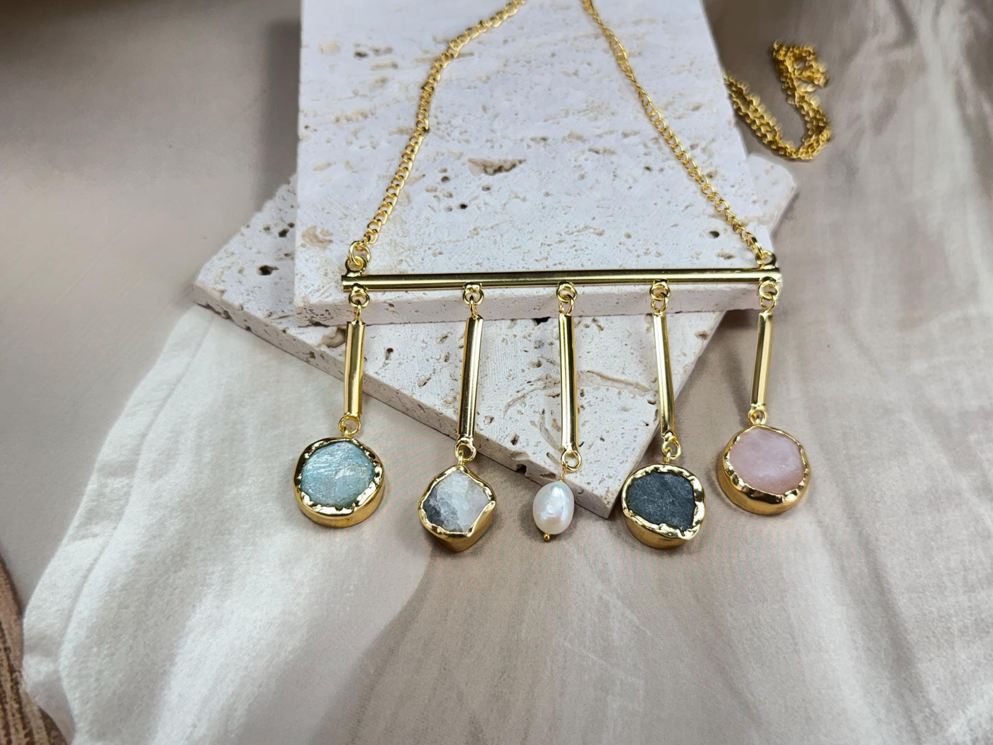 Bohemian Charm Necklace – Raw Natural Stones Drops on Gold Bar with Natural Pearl Accent.