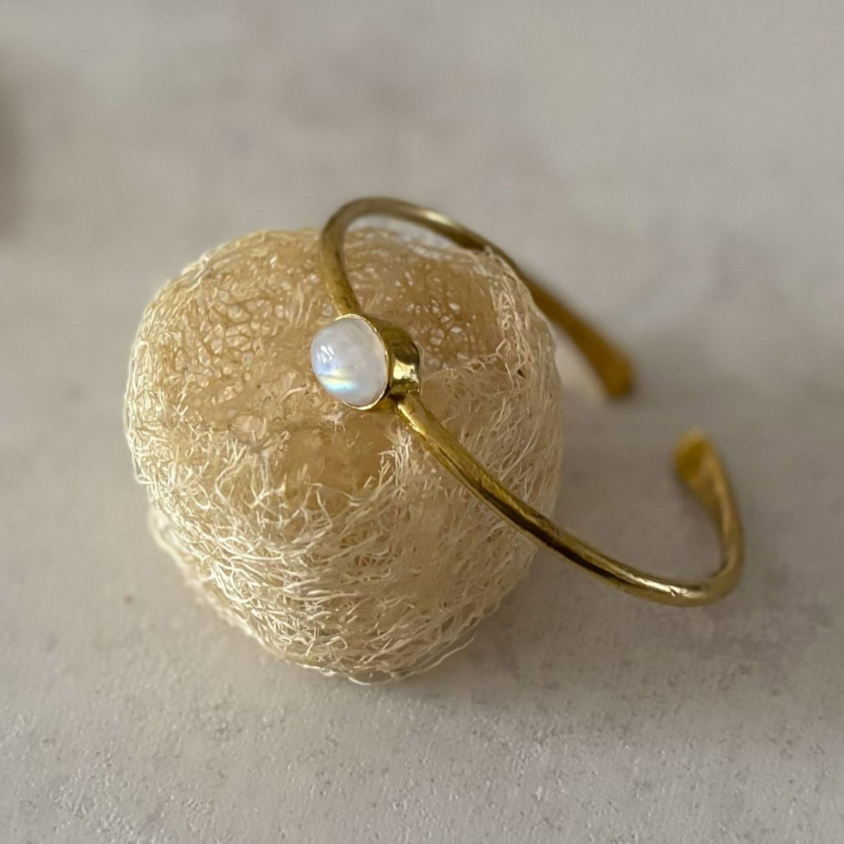 Dainty Natural Stone Cuff Bangle — First Light, moonstone with rainbow glow in a brass bezel