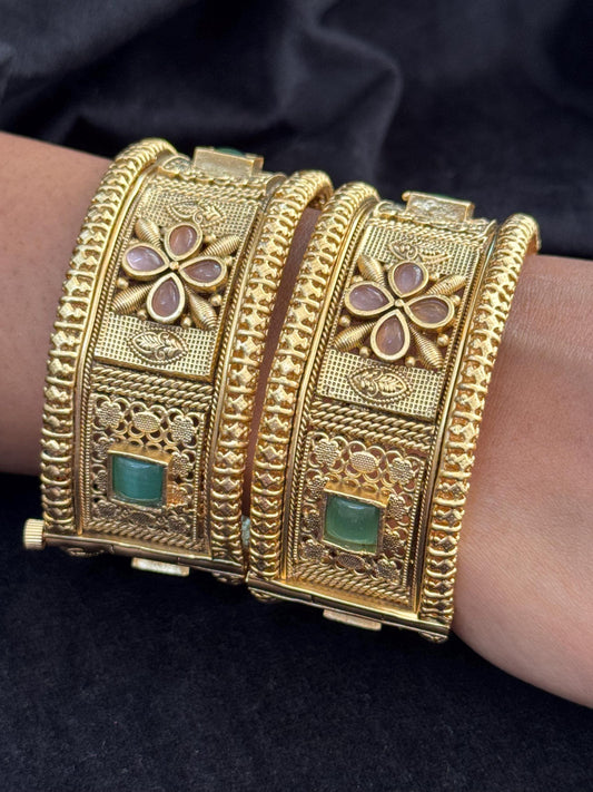 Emerald Bloom Rajwadi Kada - Gold polished bridal kada with floral pastel petal motifs and green square stones in embossed temple styling.