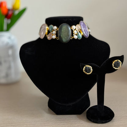 Close-up of the labradorite centre and raw stone studs on the Garden of Dusk natural stone choker set