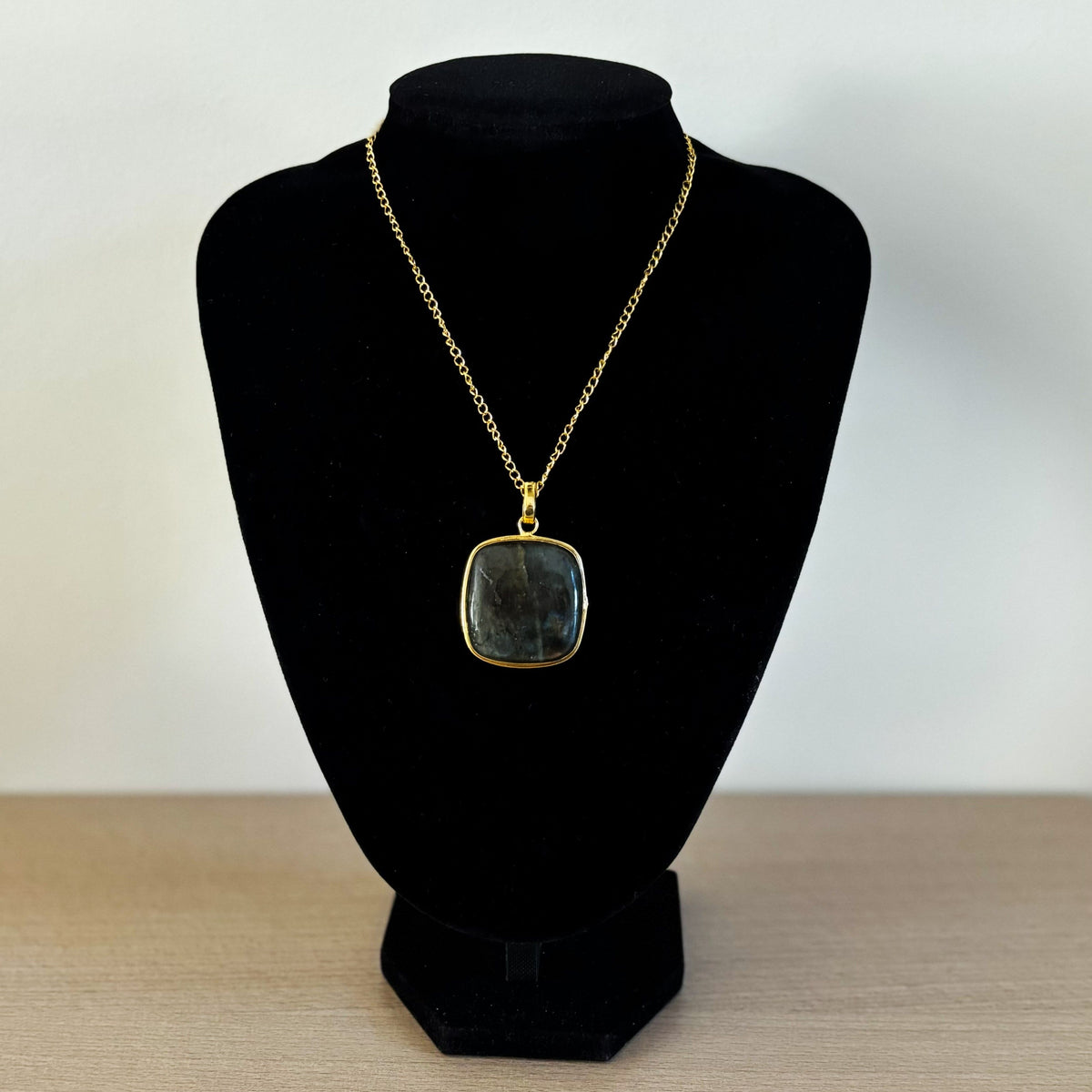 Square labradorite pendant necklace on a bust, gold-plated bezel and curb chain