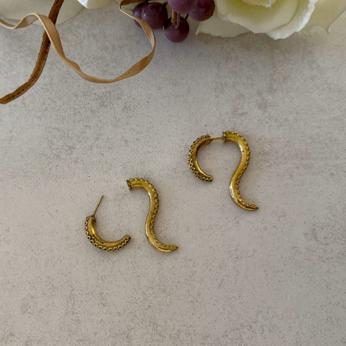 Close-up of the two-part push-fit post on Brass Octopus Tentacle Earrings — Siren Coil