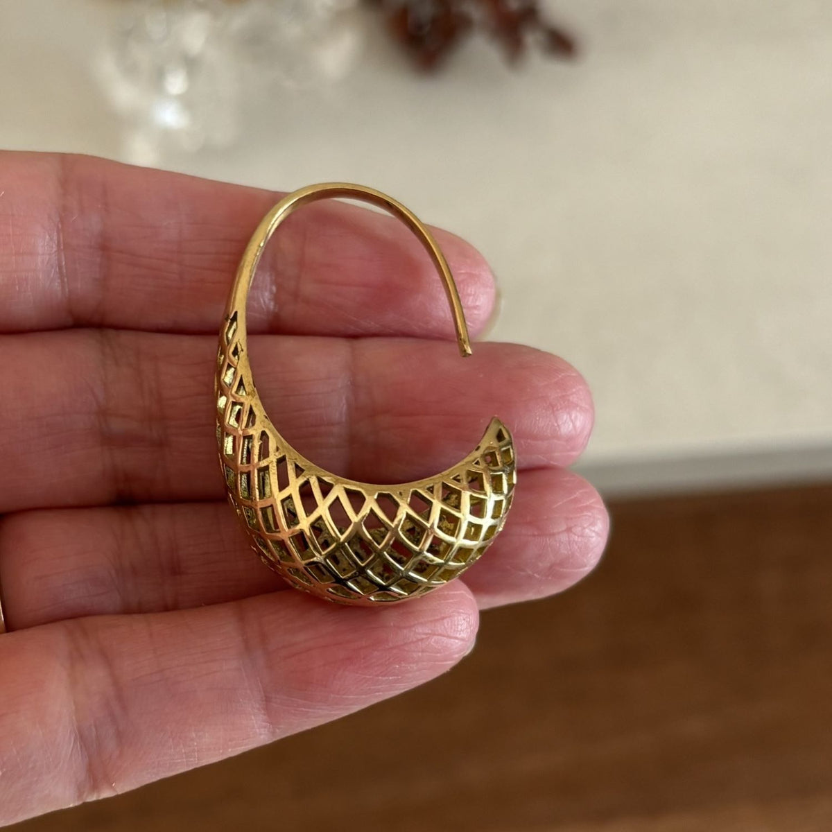 Brass Lattice Crescent Hoop Earrings — Desert Lantern held in hand, showing size and dimensions