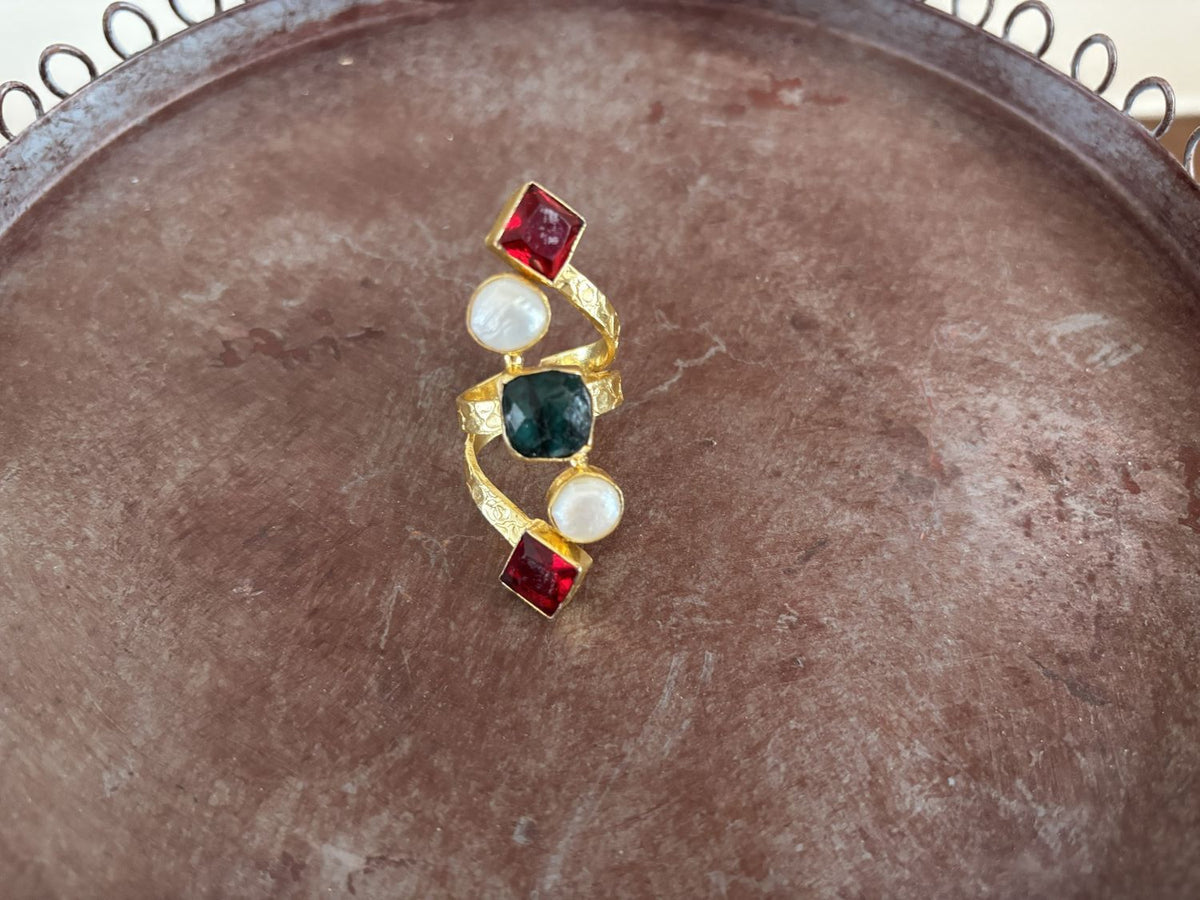 Emerald & Garnet gemstone wrap ring — raw emerald, faceted red garnets and pearls on a textured gold-plated band