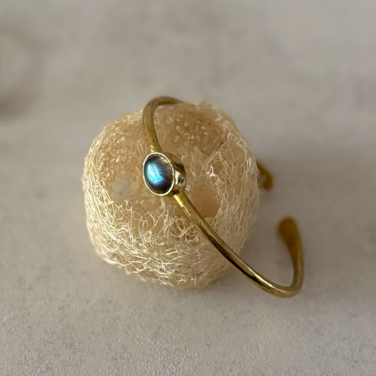 Dainty Natural Stone Cuff Bangle — First Light, labradorite with blue flash in a brass bezel