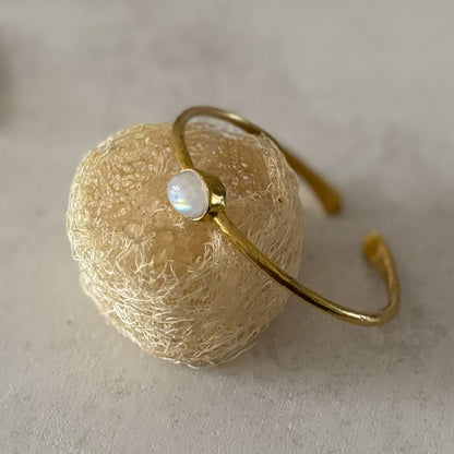 Dainty Natural Stone Cuff Bangle — First Light, moonstone with rainbow glow in a brass bezel