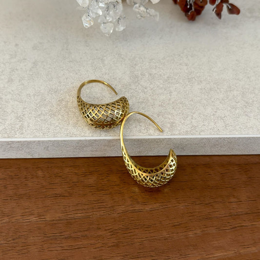 Brass Lattice Crescent Hoop Earrings — Desert Lantern, side view of the open diamond-lattice crescent and pull-through wire