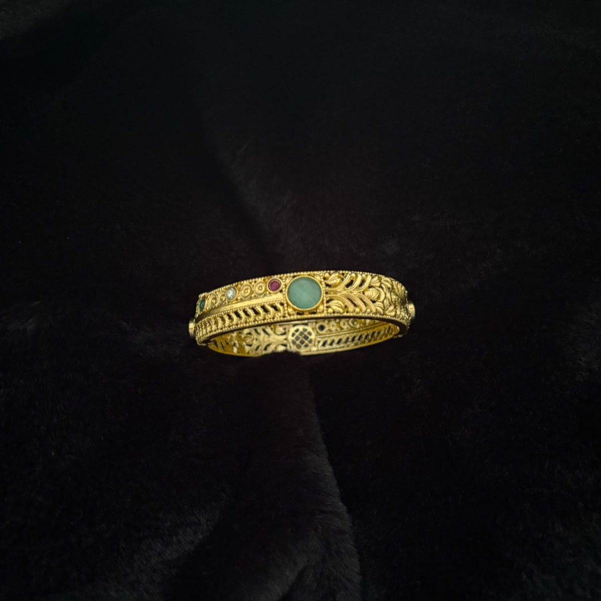 Two-Way Brass Kada Bangle — Twin Dawn, faceted mint side with screw-pin hinge, top view